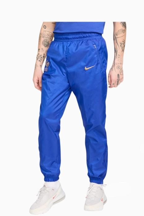 Nohavice Nike France 2024 Windrunner - Modrá